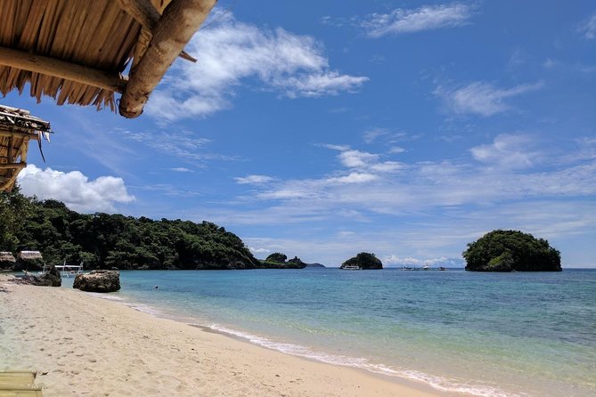 Boracay Island Hopping + Hot Kawa + Parasailing + Helmet Diving - Parasailing above White Beach
