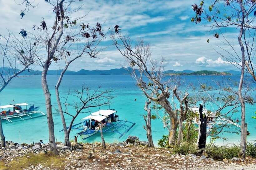 Coron: Coastal Cliffs, Beach & Malcapuya Island Hopping Tour - Bulog Dos: quieter scenery and a photogenic sandbar