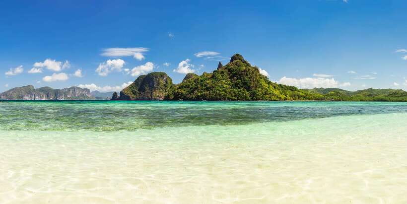 Coron Island Escapade: A Tropical Feast & Adventure - Malcapuya Island gives you the main beach day