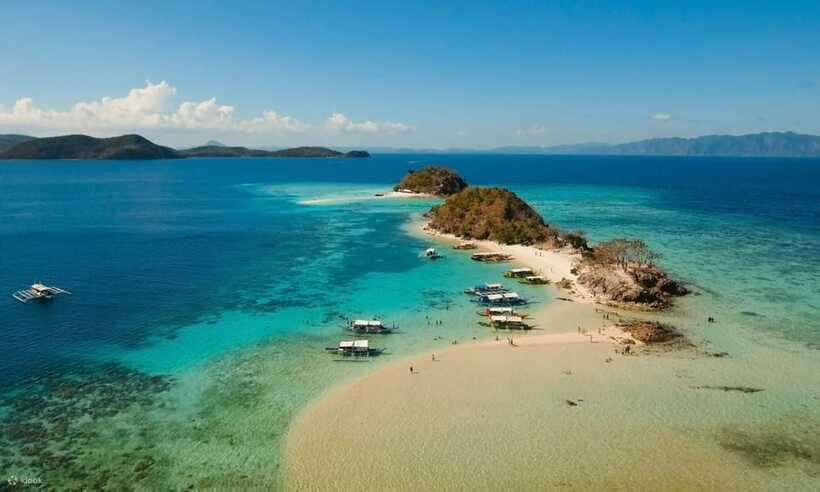Coron Town: Coron Island Escapade Private Tour with Lunch - Banana Island below the forested hills