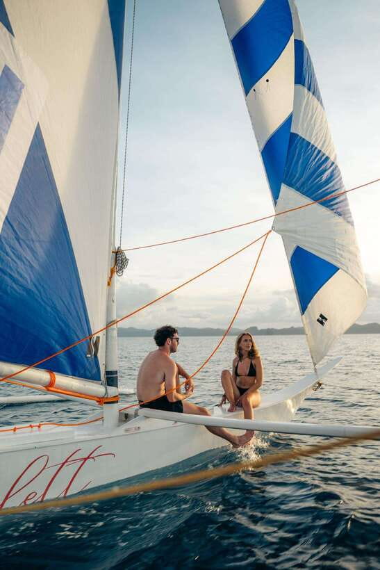 El Nido Islands: Shared Paraw Sunset Sailing - Sitting on the netting over the water