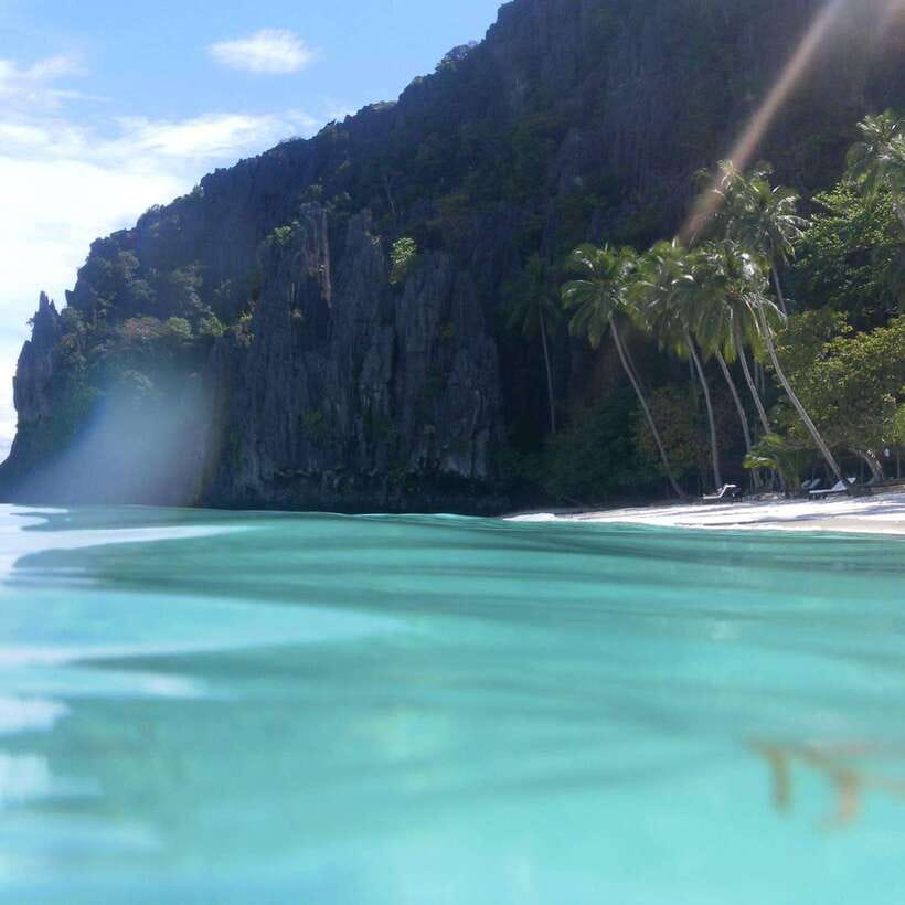 El Nido: Snake Island and Cave Tour with Island Lunch - Entalula Island, coral water, and the final photo stop