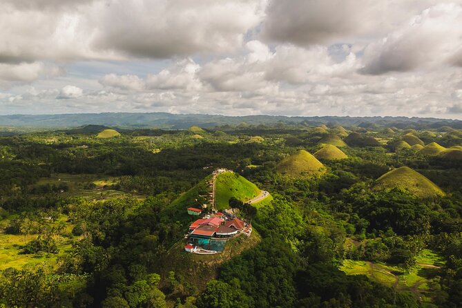 Famous Bohol Chocolate Hills Loboc River Cruise Tarsier Tour - Pythons, reptiles, and the Bohol Tarsier Conservation Area