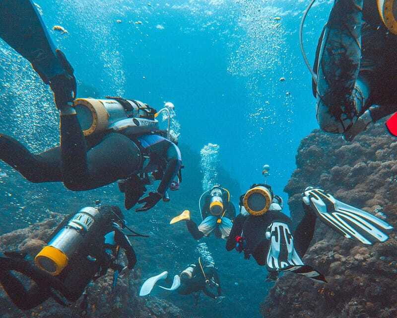 Panglao Bohol: Try Scuba Diving at Napaling and Sardines - Entering Napaling Reef with provided equipment