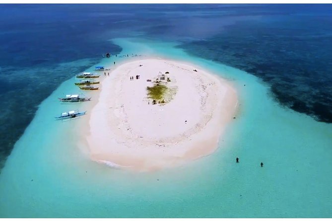 Siargao Island Hopping & land Tour - Daku Island: beach time with a local community