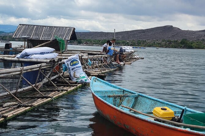 Unforgettable Manila Fishing Village Day Excursion 2024 - Boarding a local boat near Talisay, Batangas